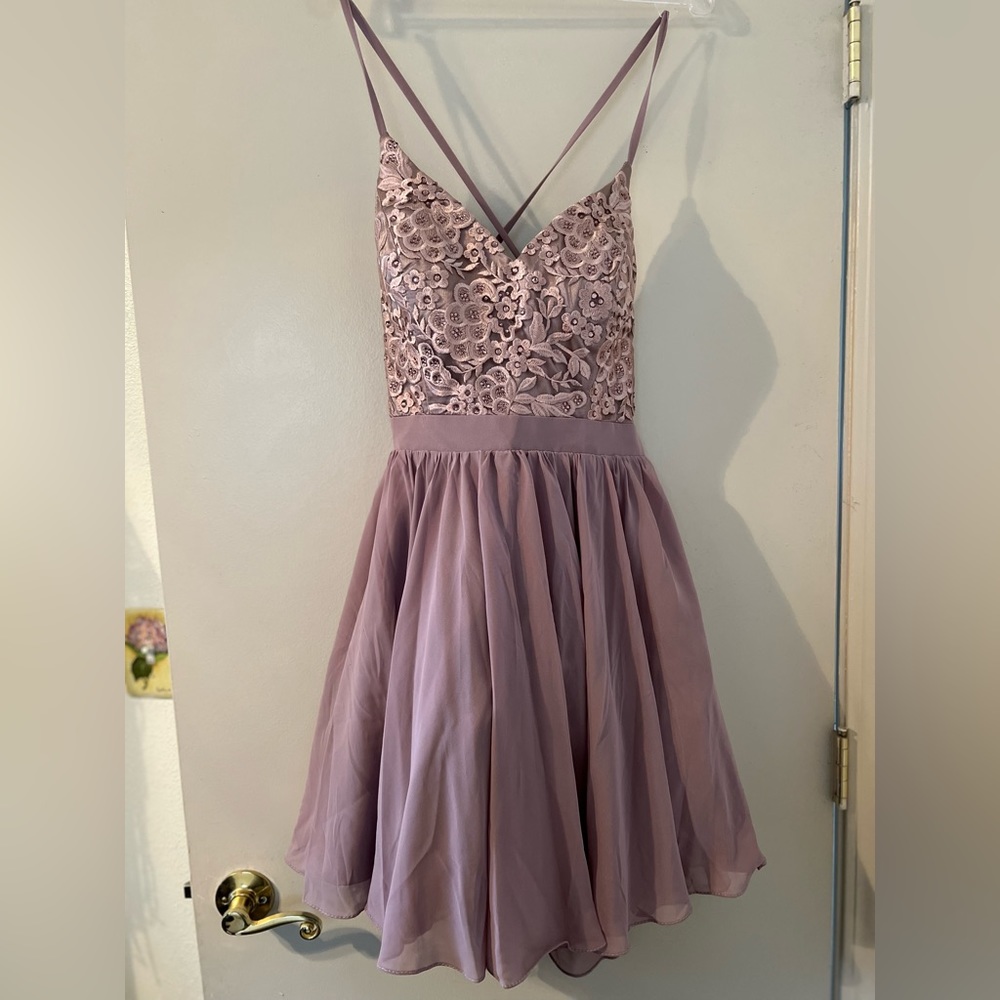Prom Girl, brand new with tags. Size Large, fits like a Medium